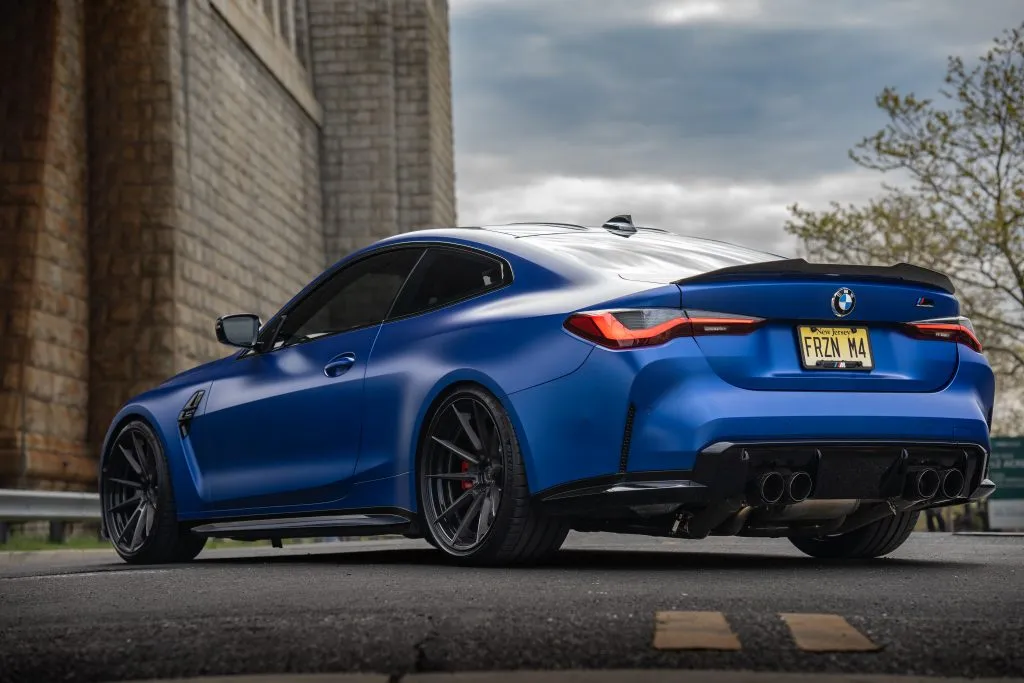 Blue G82 M4 beside the bridge tower