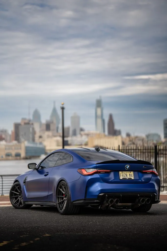 Blue G82 M4 rear three-quarter view