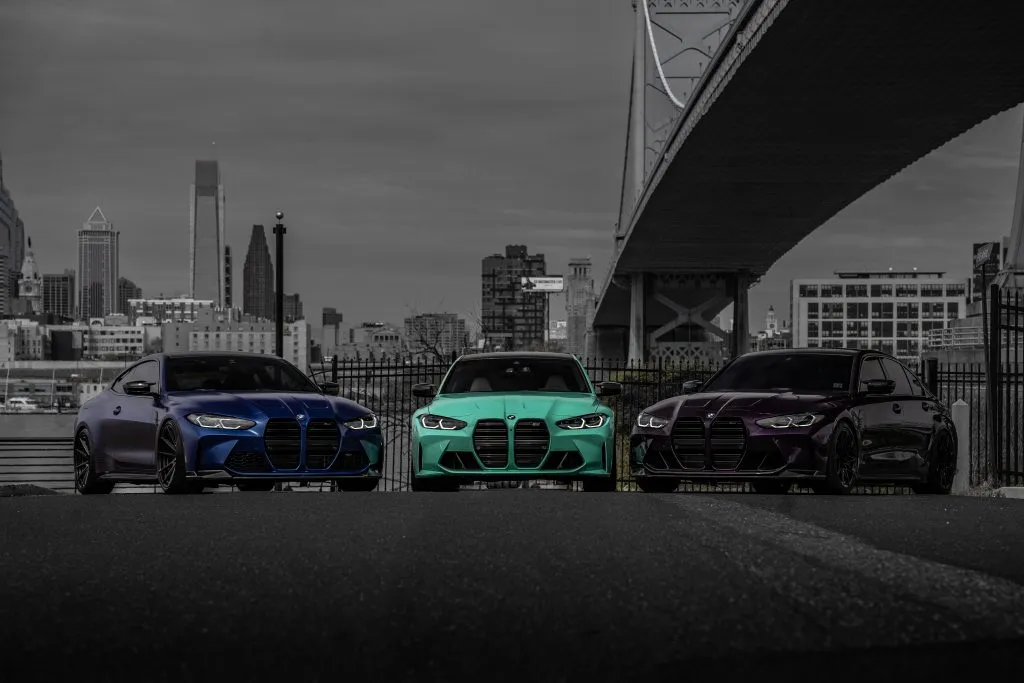 All three cars with the Philadelphia skyline behind