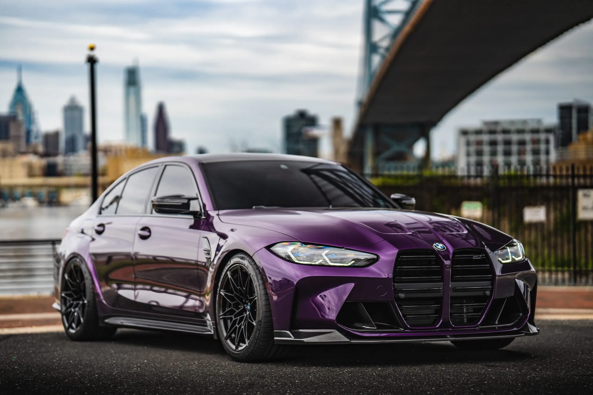 Purple G80 M3 under the Ben Franklin Bridge
