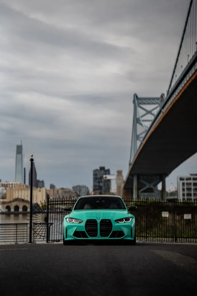 Teal G80 M3 beneath the Ben Franklin Bridge