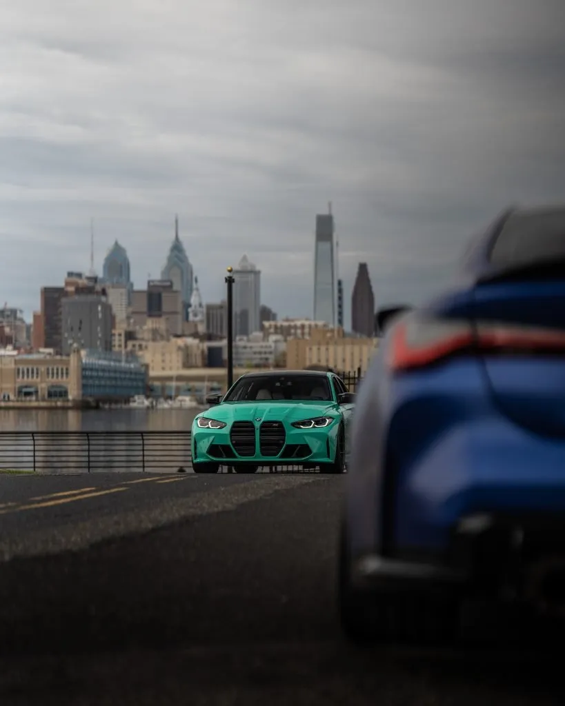 Teal G80 M3 and blue G82 M4 on the waterfront