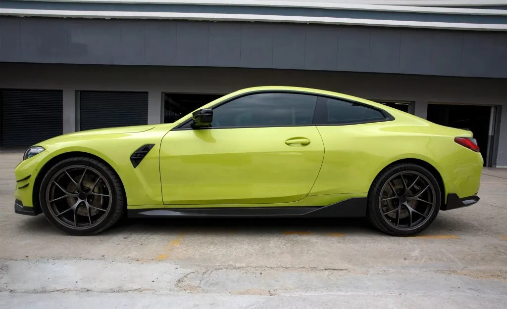 BMW G82 M4 MP style prepreg dry carbon fiber full replacement side skirts with gloss finish w/winglet — image 3 of 12