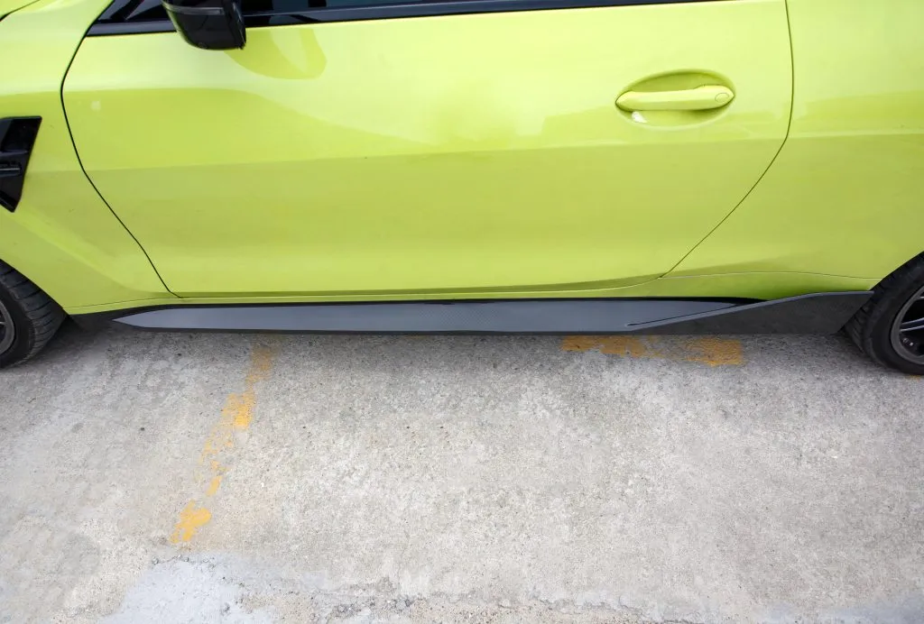 BMW G82 M4 MP style prepreg dry carbon fiber full replacement side skirts with gloss finish w/winglet — image 6 of 12