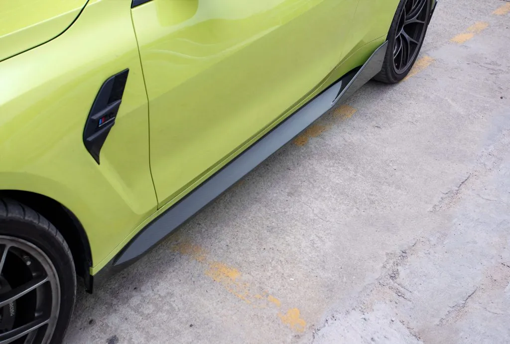 BMW G82 M4 MP style prepreg dry carbon fiber full replacement side skirts with gloss finish w/winglet — image 5 of 12