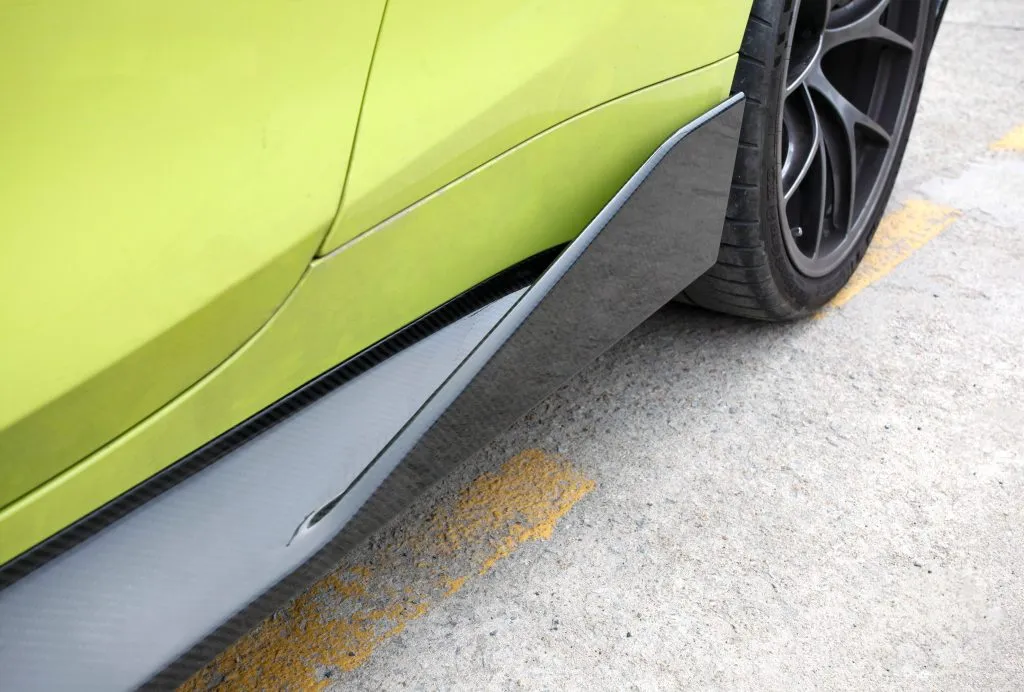 BMW G82 M4 MP style prepreg dry carbon fiber full replacement side skirts with gloss finish w/winglet — image 7 of 12
