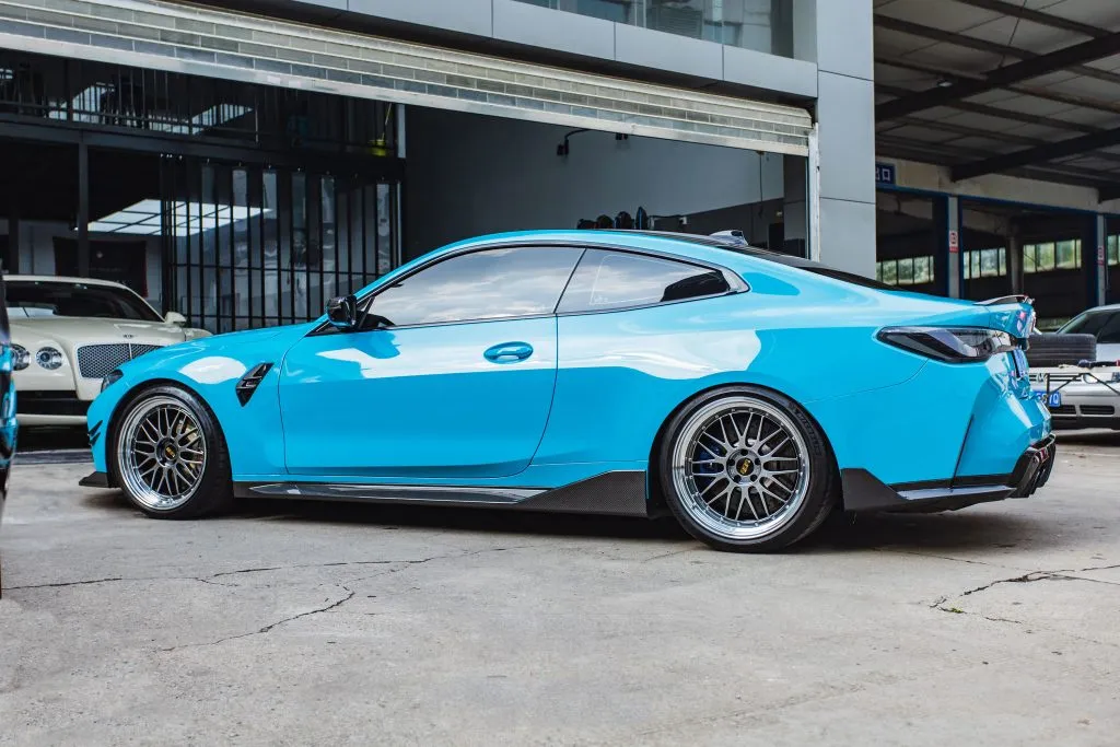 BMW G82 M4 MP style prepreg dry carbon fiber full replacement side skirts with gloss finish w/winglet — image 1 of 12