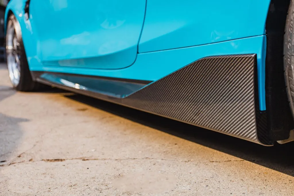 BMW G82 M4 MP style prepreg dry carbon fiber full replacement side skirts with gloss finish w/winglet — image 2 of 12
