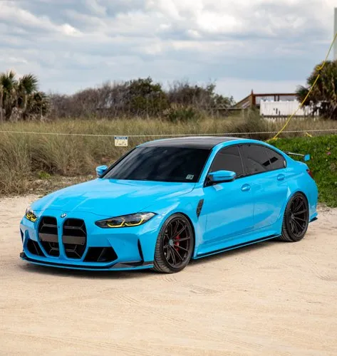 Blue BMW G80 M3 by the dunes