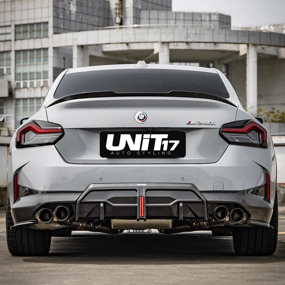 Straight rear view of a BMW G42 showing rear spats and a separate diffuser