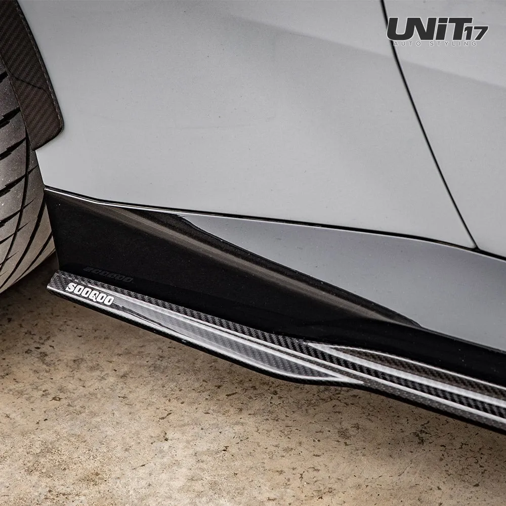 Installed G42 side skirt extension beneath the gray car’s sill